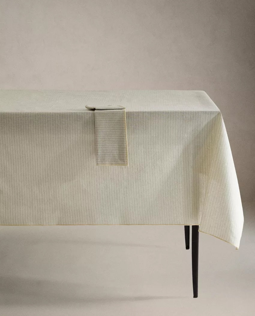 A welcoming table set with napkins and dinnerware